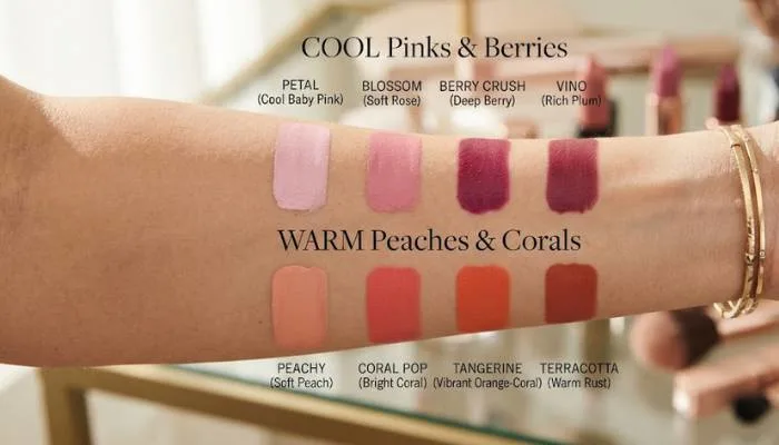 Arm swatches comparing cool pink and berry lipstick shades versus warm peach and coral lipstick shades.